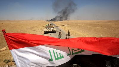 Smoke billows from Al Ayadiya, north of Tal Afar, as Iraqi forces advance on August 28, 2017 during the ongoing operation to retake the town from ISIL. Ahmad Al Rubaye / AFP