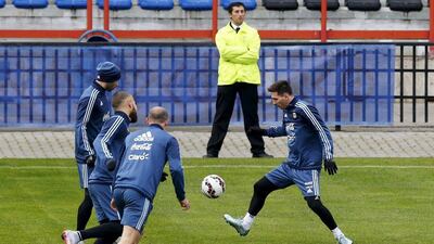 Argentina's Lionel Messi plays the ball with Javier Mascherano, left, Nicolas Otamendi, second left and Pablo Zabaleta during their team training session on Wednesday. Andres Stapff / Reuters