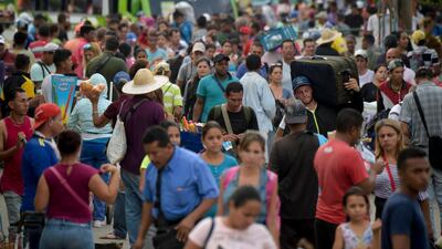 People cross the Simon Bolivar International Bridge on the border between Tachira in Venezuela and Cucuta in Colombia. AFP