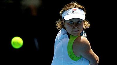 Belgium's Kim Clijsters plays a backhand against Stephanie Foretz Gacon of France.