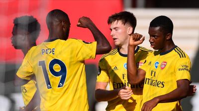 Arsenal's Eddie Nketiah celebrates with teammate Nicolas Pepe. EPA