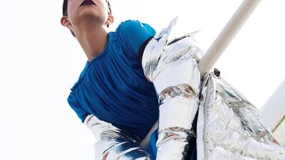 On the rails: Dress Dh14,000 and Coat Dh15,100 both Louis Vuitton; Rings Dh986 each by Roberto Cavalli; Shoes Dh2,534 Salvatore Ferragamo. 