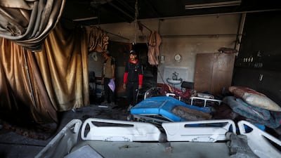 Palestinians inspect a destroyed ward inside the hospital. Reuters