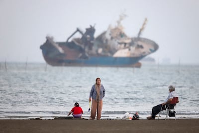 A ship lies off the coast of Bandar Abbas, southern Iran, near the Strait of Hormuz. Reuters