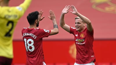 Bruno Fernandes and Donny van de Beek celebrate after United's third goal. PA