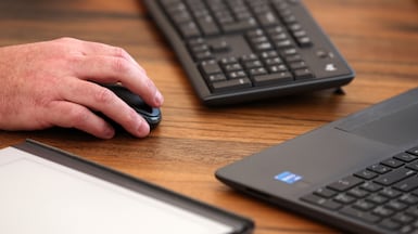 The UAE is urging remote workers to strengthen their online security. Photo: Chris Whiteoak Graeme Chalmers uses his home setup to work remotely in Dubai. Chris Whiteoak / The National
