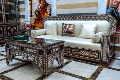 Some of the most striking furniture in the house are the pieces in the liwan, or grand hall, custom-made by artisans in Damascus. Victor Besa / The National
