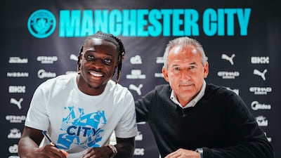 New Manchester City signing Jeremy Doku, left, with director of football Txiki Begiristain. Photo: Manchester City FC