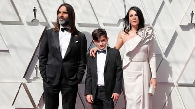 Nadine Labaki, with Khaled Mouzanar and Zain al-Rafeea, in Elie Saab at the 91st annual Academy Awards on February 24, 2019. EPA