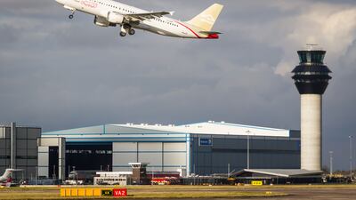 A Libyan Airlines Airbus A320 taking off from Manchester Airport. Alamy