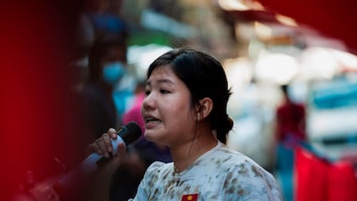 Ei Tinzar Maung speaks during a campaign ahead of the November 8 general election. AFP