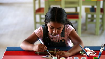 Raizel, 6, paints. An Urban Forest School Programme aims to connect school and nursery children with nature through structured group visits to XPark Jr and activities that include free play, den building, arts and crafts and campfire building.