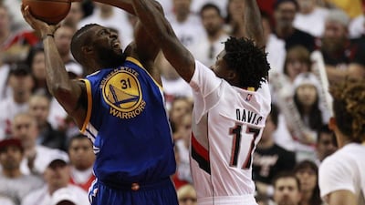 Golden State Warriors centre Festus Ezeli (L) shoots as Portland Trail Blazers centre Ed Davis (R) defends during the second half of Game 4 of the NBA Western Conference semi-finals basketball game between the Golden State Warriors and the Portland Trail Blazers at the Moda Center in Portland, Oregon USA, 09 May 2016. Steve DiPaola / EPA