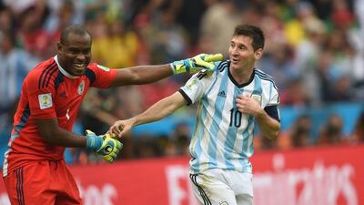 Lionel Messi, right, and Vincent Enyeama, left, acknowledge each other during Argentina's 3-2 win over Nigeria on Wednesday at the 2014 World Cup in Porto Alegre, Brazil. Pedro Ugarte / AFP / June 25, 2014