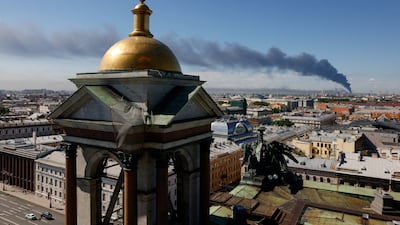 A plume of smoke billows over St Petersburg, Russia, after Ukrainian drones targeted the city. Reuters