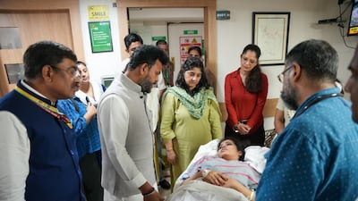 India's Civil Aviation Minister Ram Mohan Naidu Kinjarapu visits an injured passenger at Fortis Hospital in Delhi. Photo: PIB
