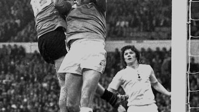 File photo dated 27-05-1982 - Tottenham goalkeeper Ray Clemence gathers the ball as QPR's Simon Stainrod goes up. PA Photo