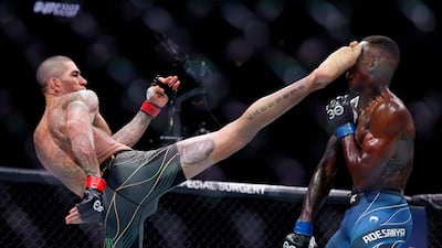 Alex Pereira kicks Israel Adesanya in their middleweight title bout during UFC 287 at Kaseya Center.