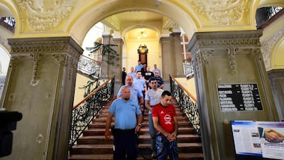 Members of an international smuggler group are pictured at a courthouse in Hungarian town Kecskemet in 2017, during the opening of a trial in connection with deaths of 71 migrants. The verdict is expected on June 14. AFP