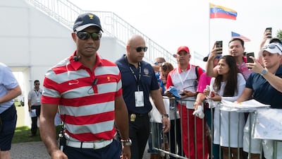US Team assistant captain Tiger Woods during The Presidents Cup golf tournament at Liberty National Golf Course. Bill Streicher / USA Today