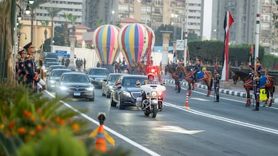 Sheikh Mohamed travels by motorcade to a reception hosted by Mr El Sisi. Photo: Hamad Al Kaabi / UAE Presidential Court