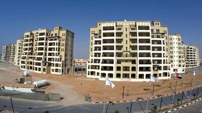 High connection fees in RAK's Al Hamra Village development are giving buyers an unpleasant surprise. Above, an apartment complex in the development under construction. Jeff Topping / The National