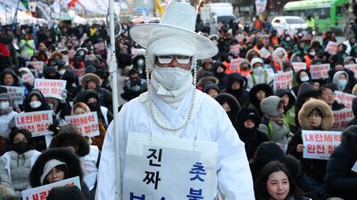 Members of the Korean Confederation of Trade Unions stage a rally in front of the National Assembly in Seoul, South Korea, a year after they protested in defiance of former president Yoon Suk Yeol's brief imposition of martial law. Getty Images