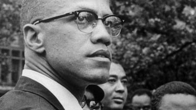 In this 1963 file photo Malcolm X attends a rally at Lennox Avenue and 115th Street in the Harlem neighbourhood of New York AP