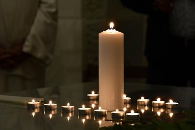 Faith leaders lit candles at the Saturday service. Nano Saralishvili for The National