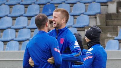 England's Eric Dier, centre, with teammates. Reuters