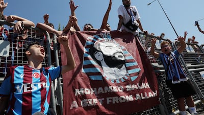 Trabzonspor fans wait for the arrival of Mohamed Salah outside the airport. Reuters
