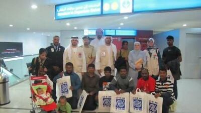 Eleven of the Sri Lankan refugees at Dubai airport before flying out to their new homes in the US last month. Photo courtesy Red Crescent Authority