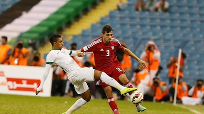 Walid Abbas of UAE is tackled by Saudi Arabia’s Salem Al Dawsari. Courtesy Al Ittihad