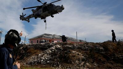 A Royal Navy helicopter takes off outside Marsh Harbour Healthcare Centre as international relief for the hurricane-hit islands arrived on Friday. Reuters