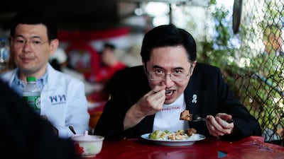 Pheu Thai Party’s leading prime ministerial candidate, Yodchanan Wongsawat, eats in Bangkok ahead of Thailand’s February 8 general election. Reuters