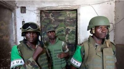 Soldiers of the African Union Mission in Somalia stand at the entrance of the strategic K4 base in Mogadishu.