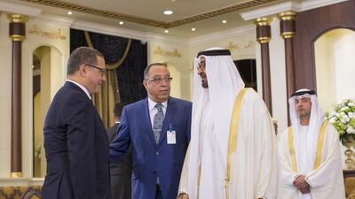 Sheikh Mohammed bin Zayed, Crown Prince of Abu Dhabi and Deputy Supreme Commander of the Armed Forces, second right, greets Mohammed Boussaid, Morocco’s Minister of Economy and Finance. Seen with them are Sheikh Hazza bin Zayed, National Security Advisor and Vice Chairman of the Abu Dhabi Executive Council, right. Ryan Carter / Crown Prince Court - Abu Dhabi