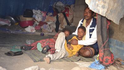Abdulwasse Hassan and his family inside a tent in Al Maafer district on 16 February after they fled another camp. Mohammed Al Qalisi for the National