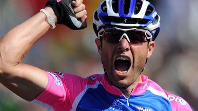 In this file photograph taken on July 4, 2010, Italy's Alessandro Petacchi celebrates on the finish line in Brussels at the end of the 203,5 km and first stage of the 2010 Tour de France. The Italian is one of four current and former cyclists to have been provisionally suspended for potential doping violations following information from the Austrian law enforcement authorities, the International Cycling Union (UCI) said on Wednesday. AFP