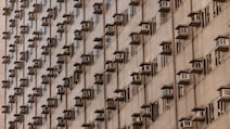 Air conditioners on the side of an apartment building in Pasay, Metro Manila, Philippines. The energy crisis is driving up electricity costs with AC becoming both a necessity and a financial burden. Getty Images