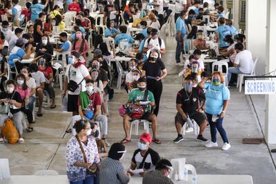 People wait to be vaccinated at the Marikina Sports Complex in Marikina City, Metro Manila. Bloomberg via Getty Images