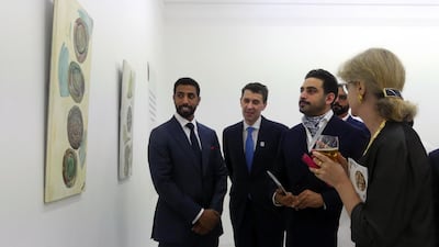 Sheikh Mohammed bin Nahyan Al Nahyan, the UAE's ambassador to the UK, Mansoor Abulhoul, Sheikh Zayed bin Sultan Al Nahyan and curator Janet Rady attend the opening of the exhibition at Pi Artworks. Jonathan Milton