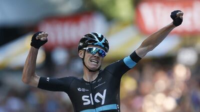 Britain’s Chris Froome celebrates as he crosses the finish line to win the eighth stage of the Tour de France on Saturday. Christophe Ena / AP Photo / July 9, 2016