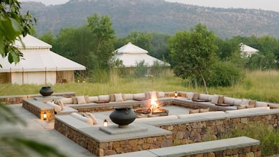 Perched on a gentle slope on the outskirts of the Ranthambore National Park, this intimate safari camp comprises just 10 sumptuous mogul-style tents – their billowing cream canvases providing a sharp contrast to the surrounding rustic scenery. Once a hu???
