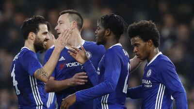 Michy Batshuayi, centre, celebrates with Cesc Fabregas, left, John Terry and Willian. Stefan Wermuth / Reuters