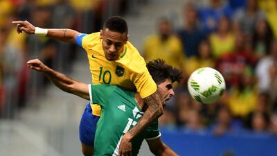 Brazil’s Neymar vies for the ball with Iraq’s Alaa Ali during the Rio 2016 Olympic Games Men’s First Round Group A football match against Iraq, at the Mane Garrincha Stadium in Brasilia on August 7, 2016. (AFP)