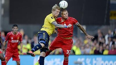 Simon Makienok of Brondby, left, vies with Martin Skrtel of Liverpool. Liselotte Sabroe / AFP