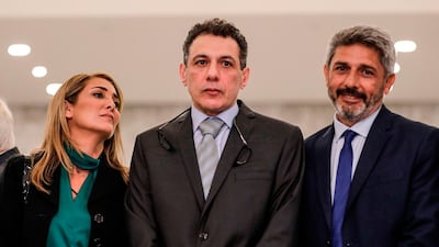 Nizar Zakka, centre, a Lebanese national and US resident arrested in 2015 and sentenced to 10 years in jail on espionage charges, prepares to give a press conference with his wife, left, and brother after he was freed at the presidential palace in Baabda, Lebanon. AFP