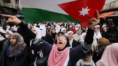 Demonstrators hold Jordanian national flags and chant slogans during a protest against a government's agreement to import natural gas from Israel, in Amman, Jordan. REUTERS