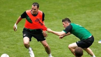 Ireland's John O'Shea, left, is pulled off by Robbie Keane during a training session of Republic of Ireland at the Euro 2012 soccer championship in a stadium in Gdynia Poland, Tuesday, June 12, 2012. (AP Photo/Peter Morrison) *** Local Caption *** Soccer Euro 2012 Training Ireland.JPEG-03a28.jpg